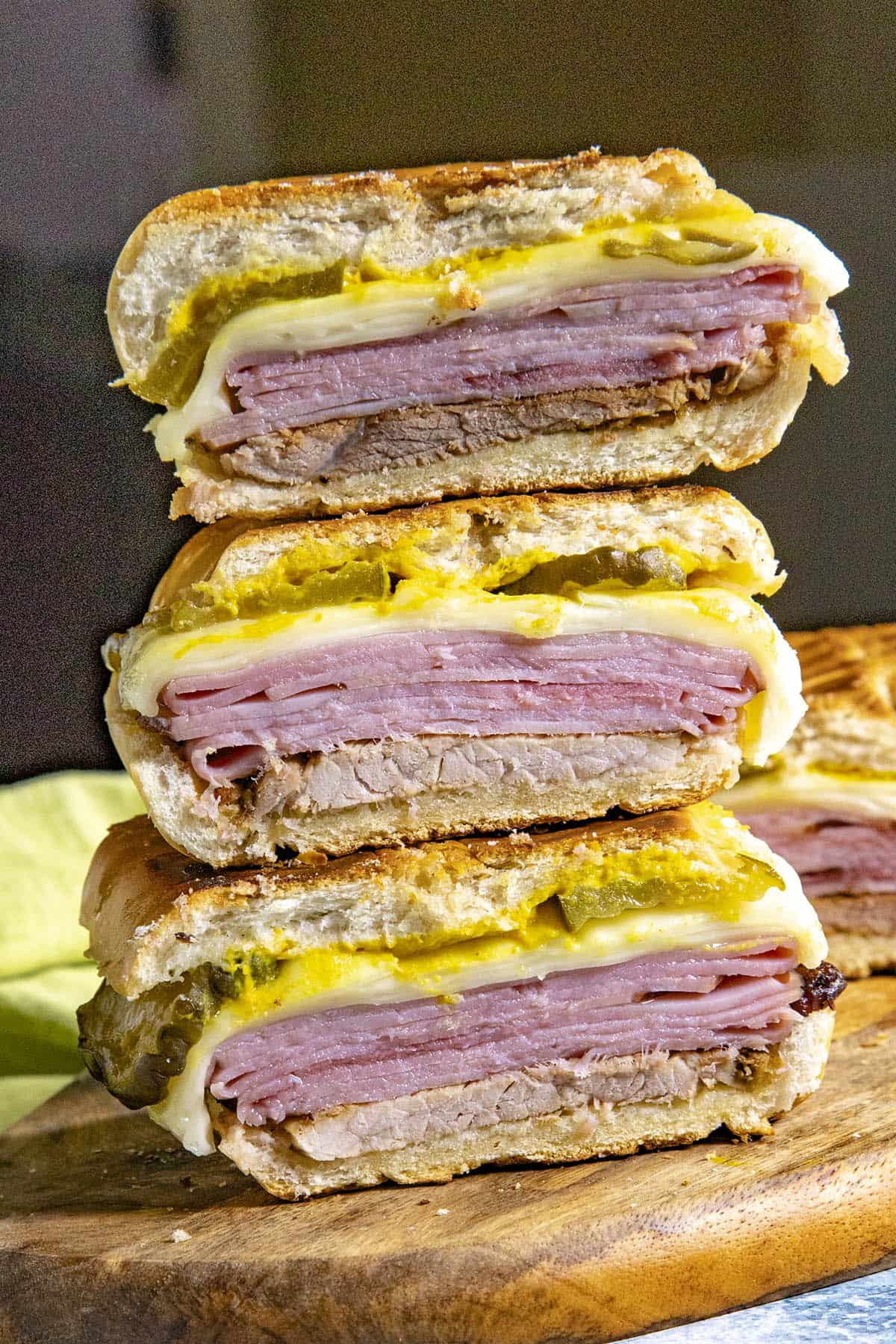 A stack of sliced Cuban sandwiches on a platter