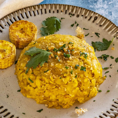 Mofongo on a plate with garnish