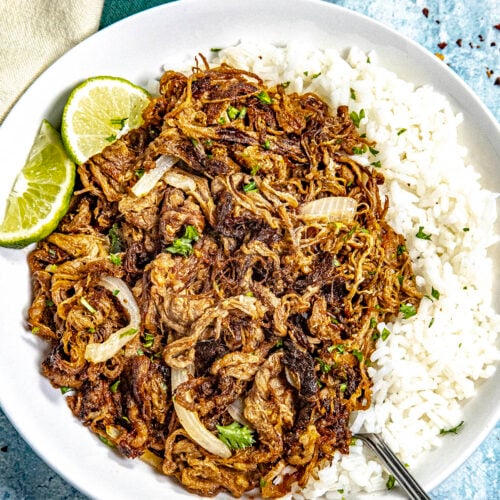 Cuban fried beef (Vaca Frita) on a plate served over white rice