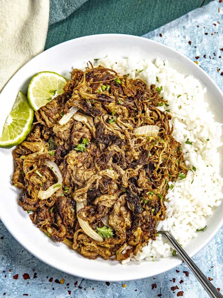 Cuban fried beef (Vaca Frita) on a plate served over white rice