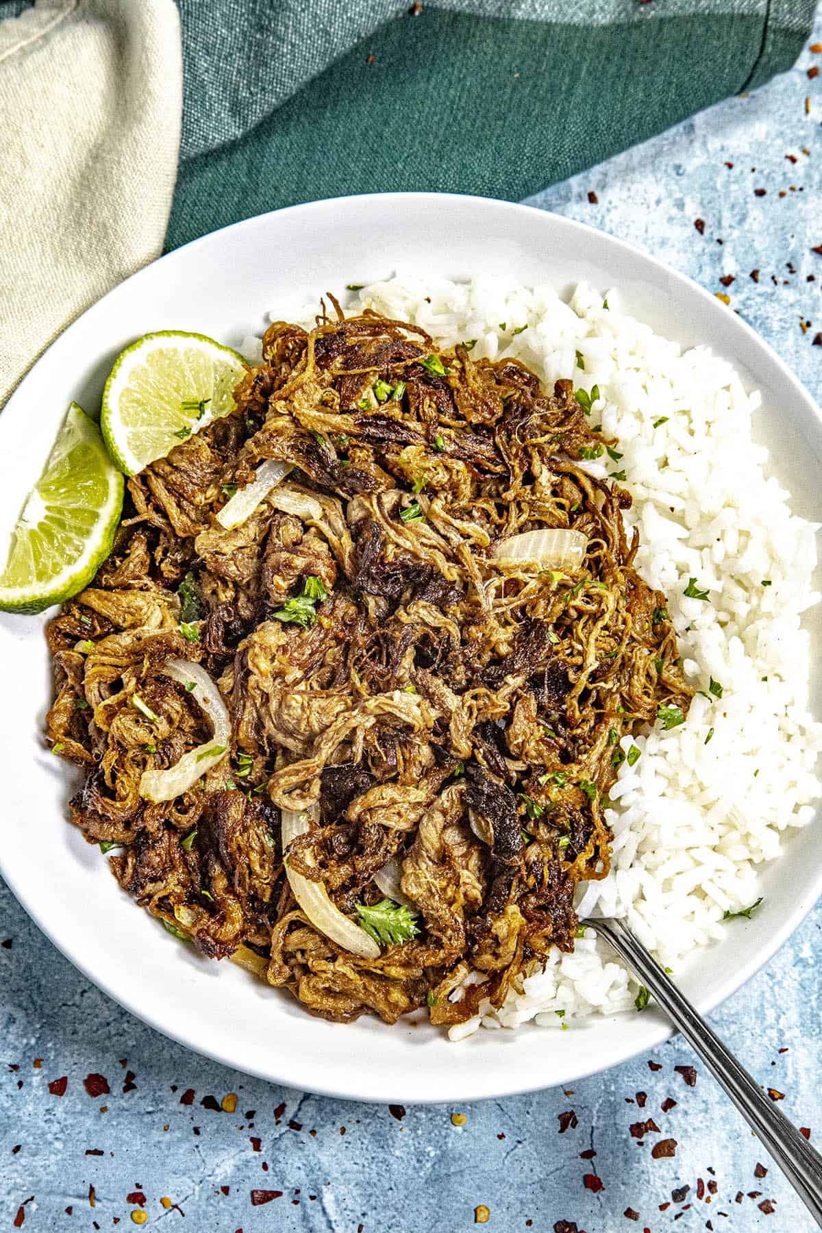 Cuban fried beef (Vaca Frita) on a plate served over white rice