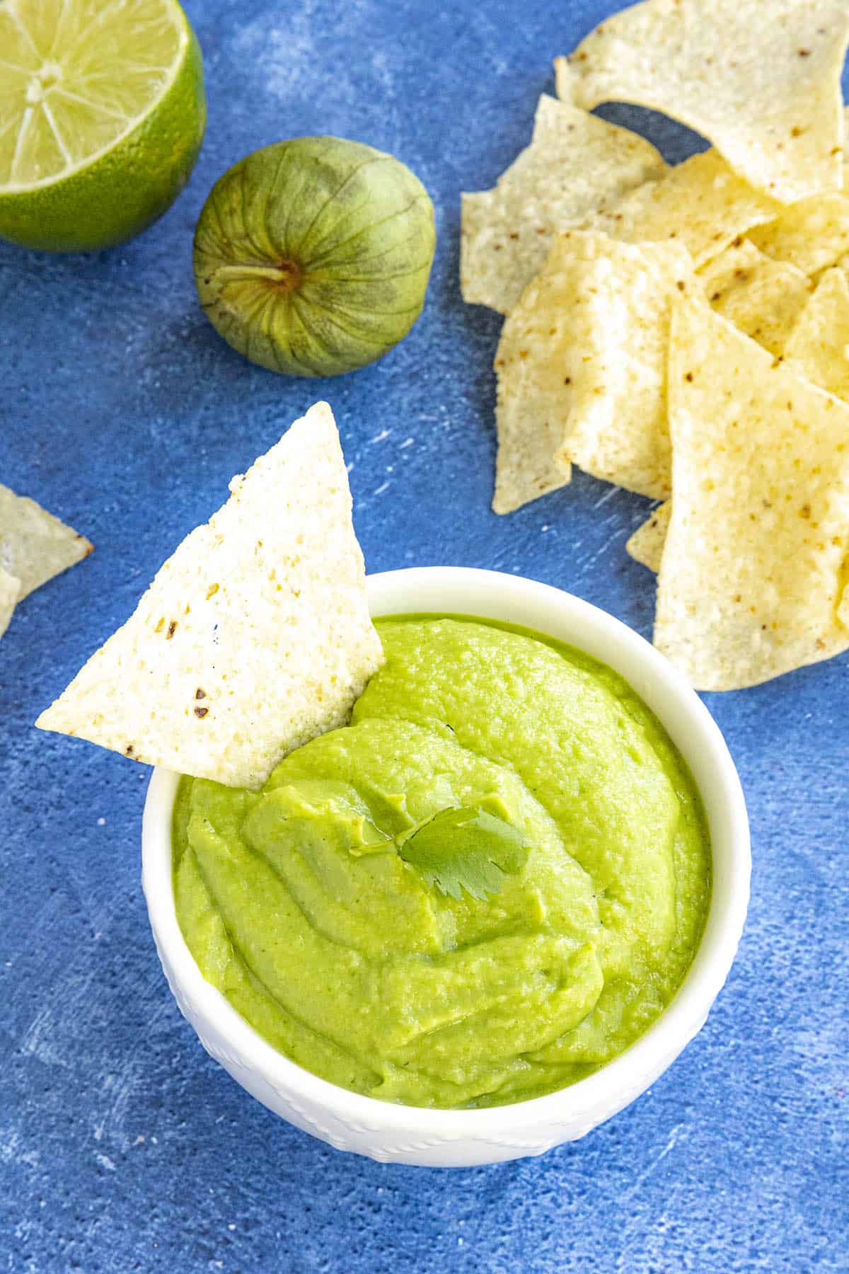 Creamy Avocado Salsa Verde in a bowl, ready to serve with Tortilla Chips