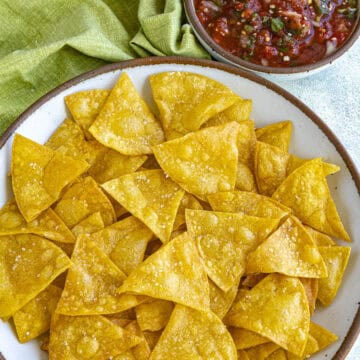 Mike dipping a Homemade Tortilla Chip into a bowl of salsa