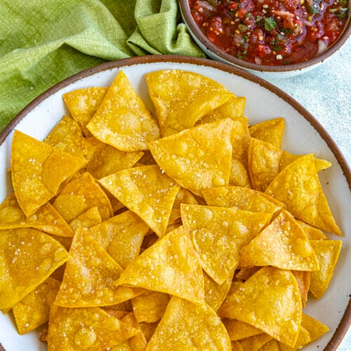 Mike dipping a Homemade Tortilla Chip into a bowl of salsa