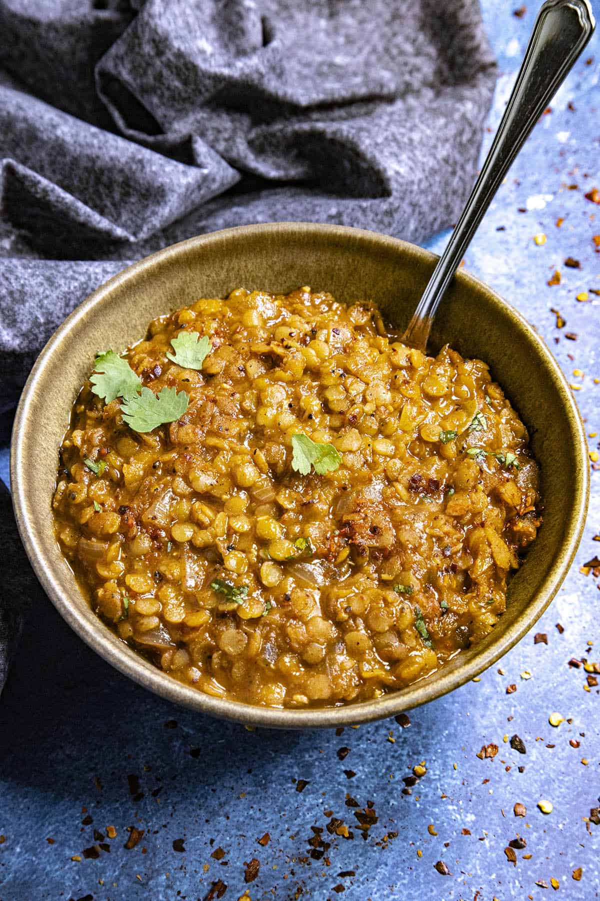 A bowl of Misir Wot (Ethiopian Spicy Red Lentils) with a spoon