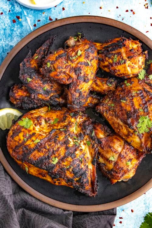 Grilled Harissa Chicken served on a plate with garnish
