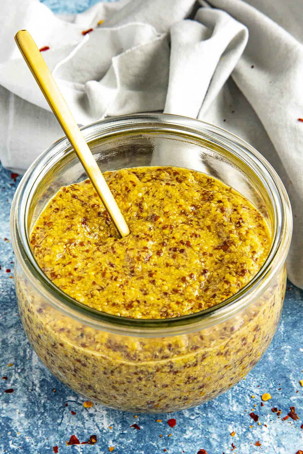 A jar of spicy Homemade Honey Beer Mustard, ready to serve