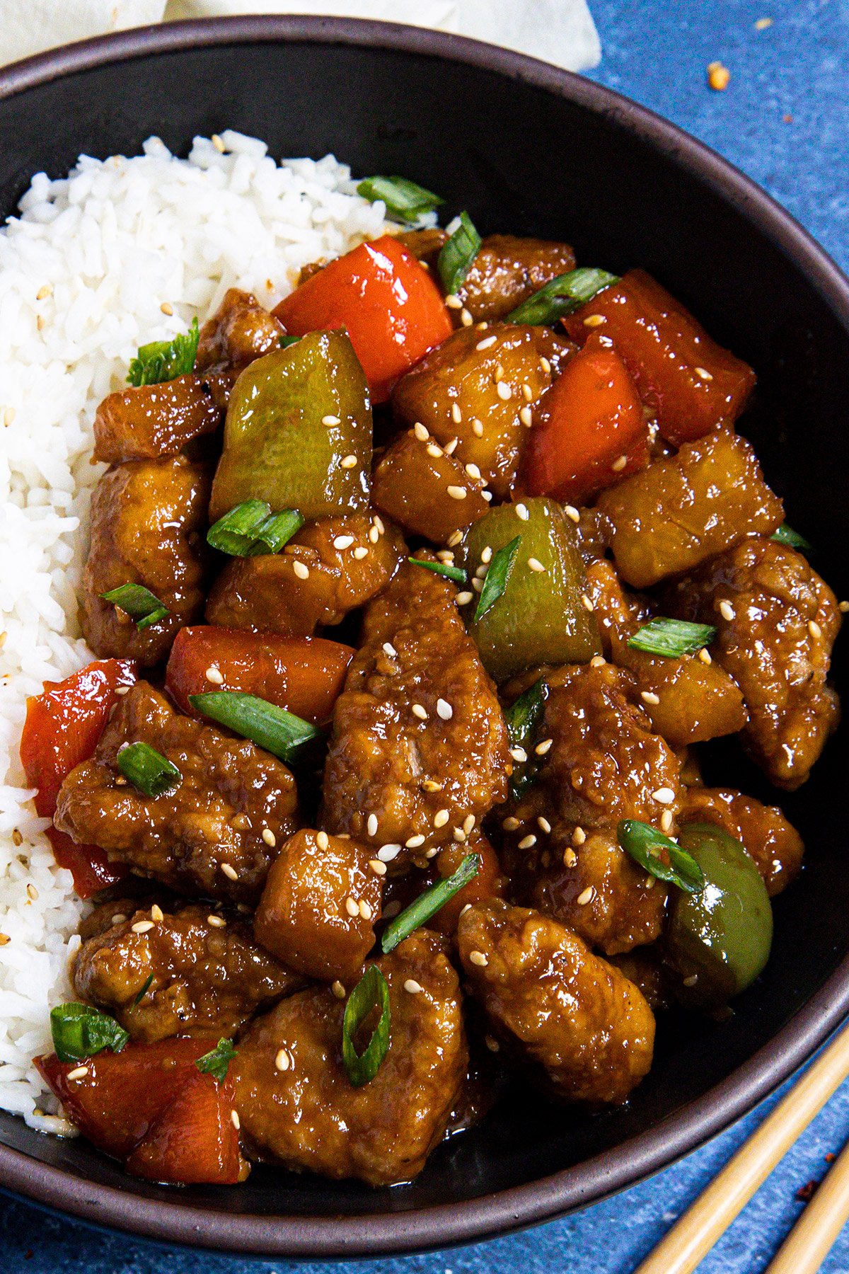 Sweet and Sour Pork served in a bowl with white rice