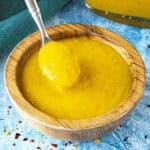 Fiery yellow Bajan Hot Sauce in a bowl