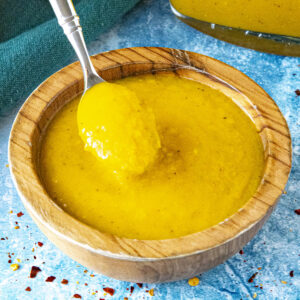 Fiery yellow Bajan Hot Sauce in a bowl