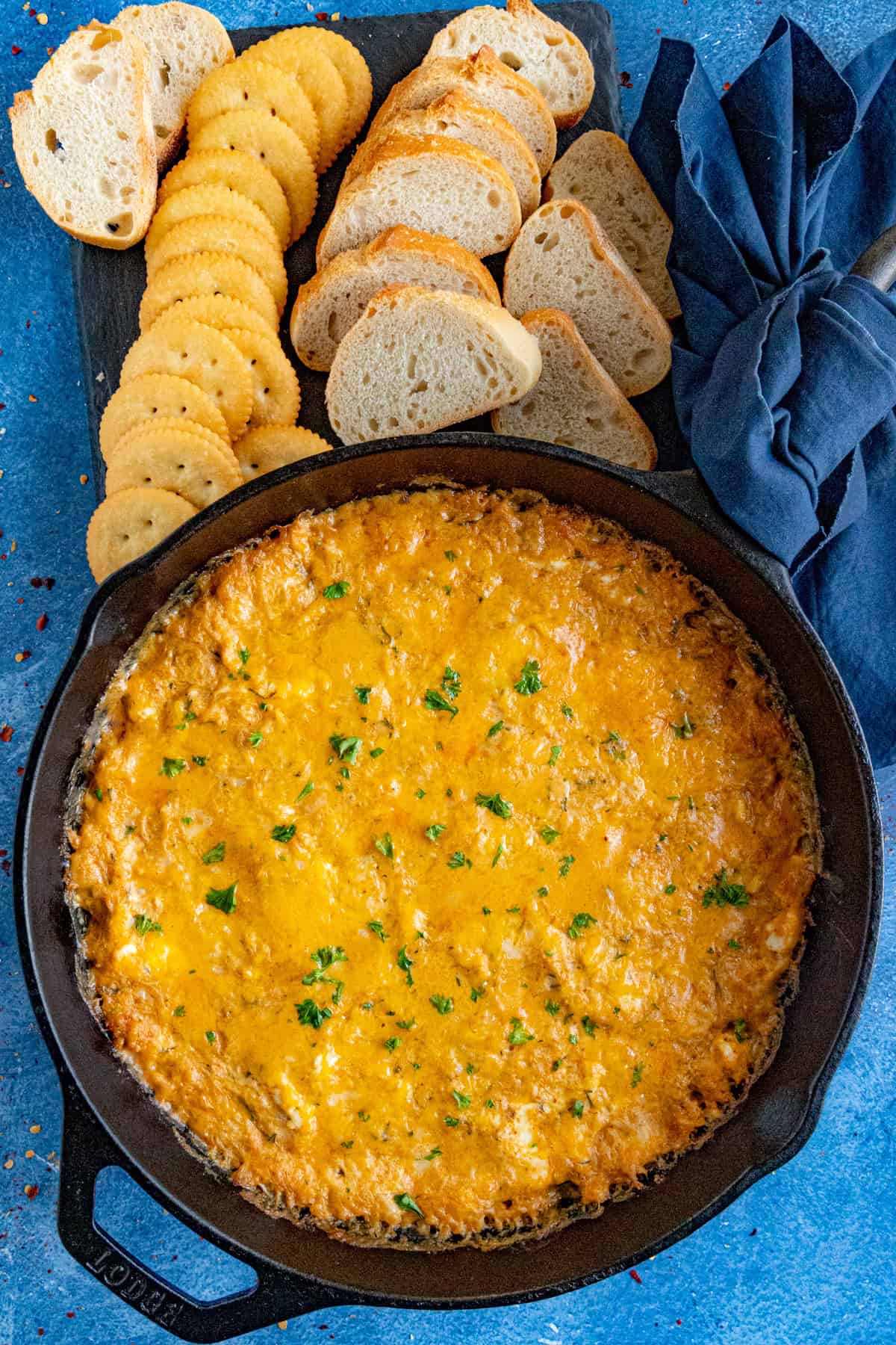 Cheesy crab dip straight out of the oven, topped with melty cheese
