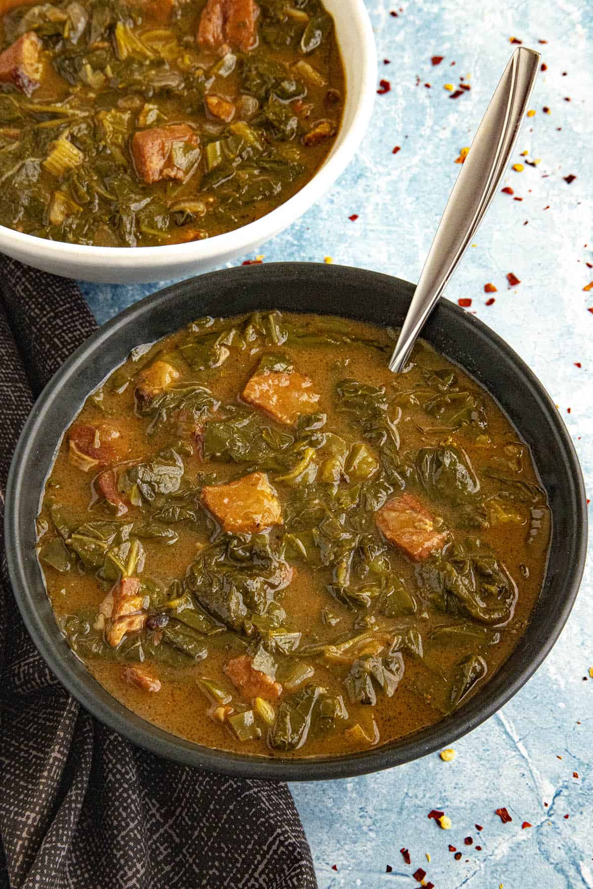 Rich Gumbo Zherbes (Green Gumbo) in a bowl with a spoon