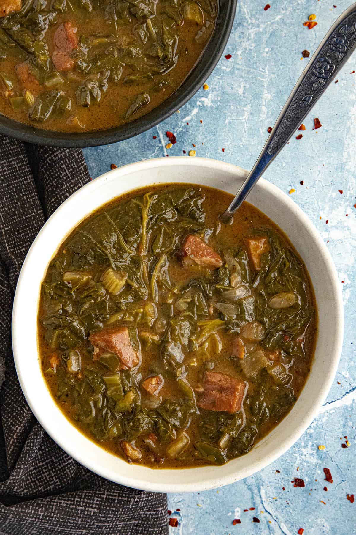Creole Gumbo Zherbes (Green Gumbo) served in a bowl with a spoon