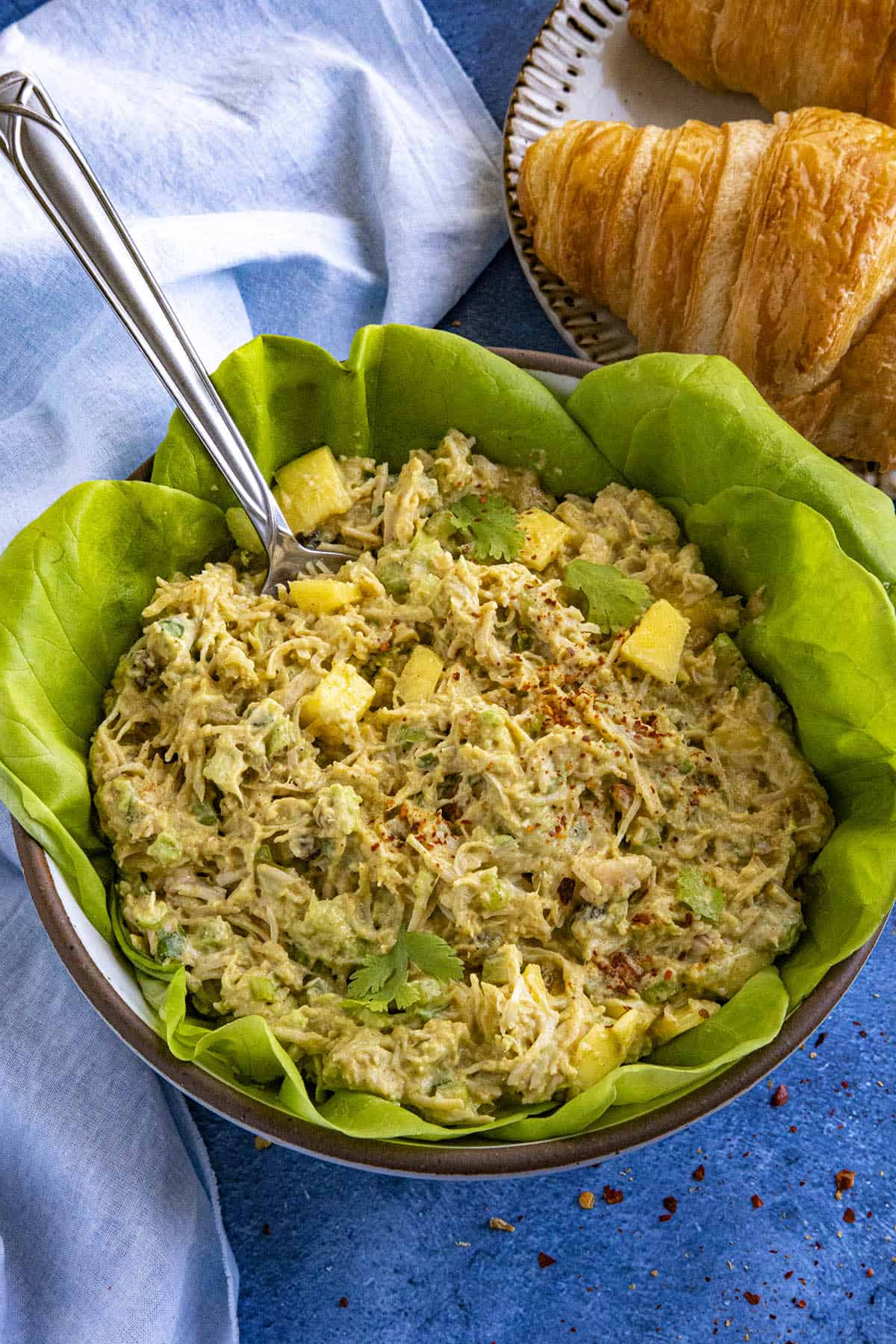 Curry Chicken Salad in a bowl over bib lettuce
