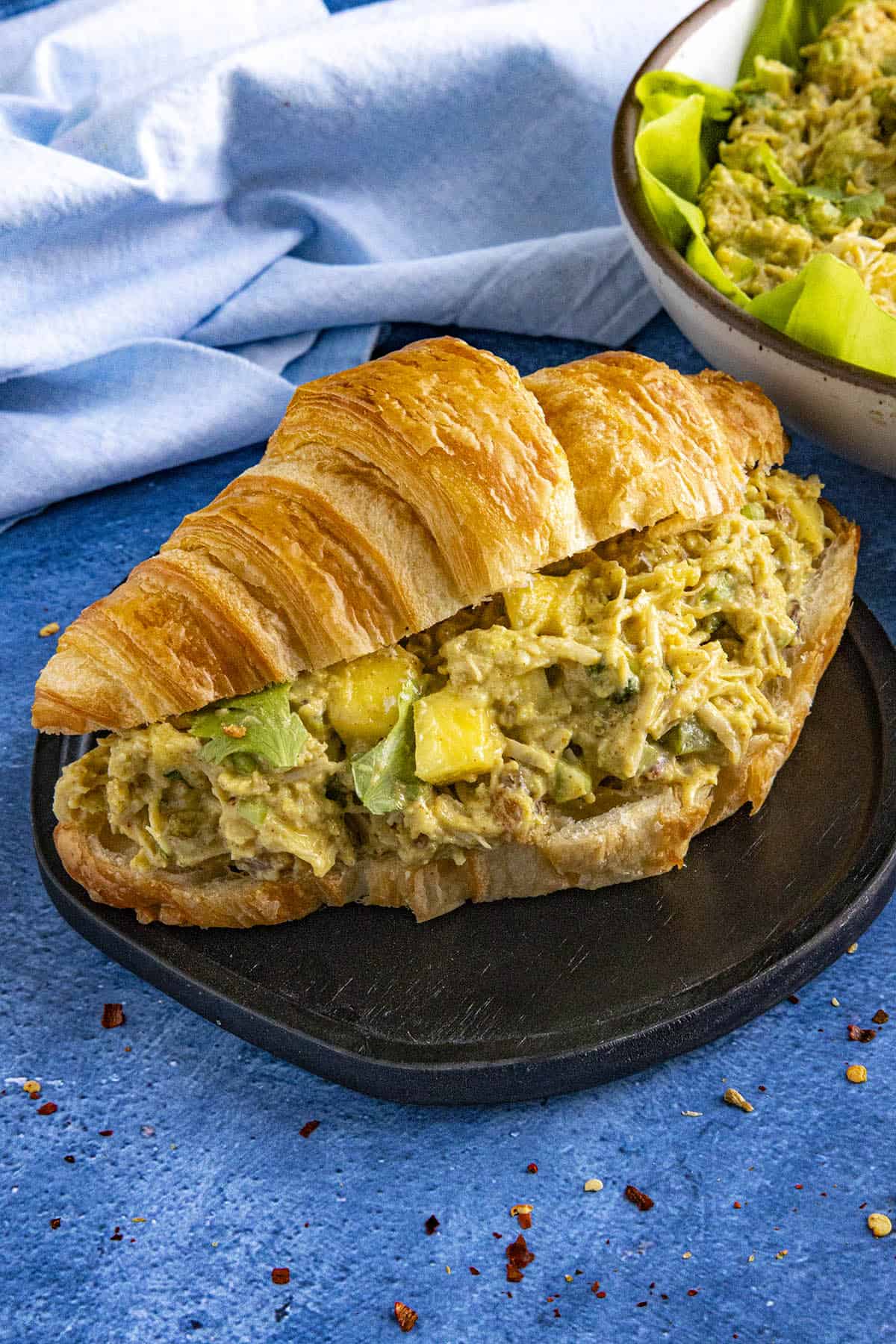 Spicy Curry Chicken Salad sandwich on a serving plate
