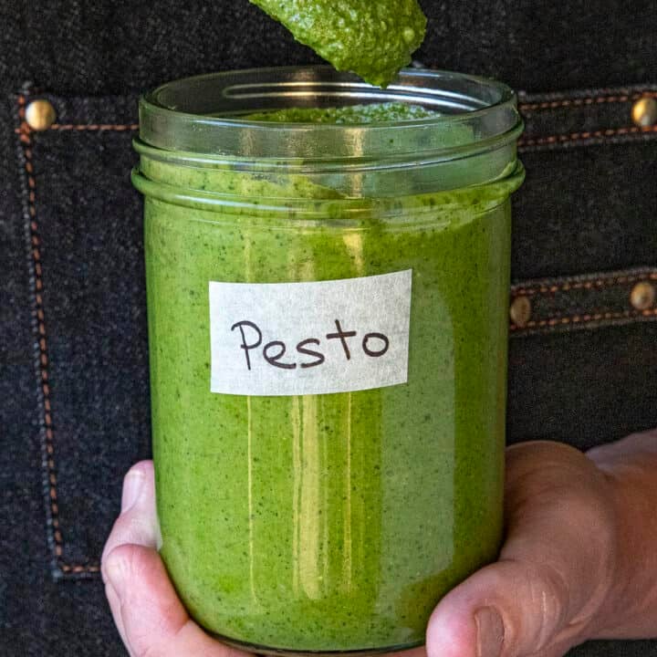 Mike holding a jar of homemade pesto