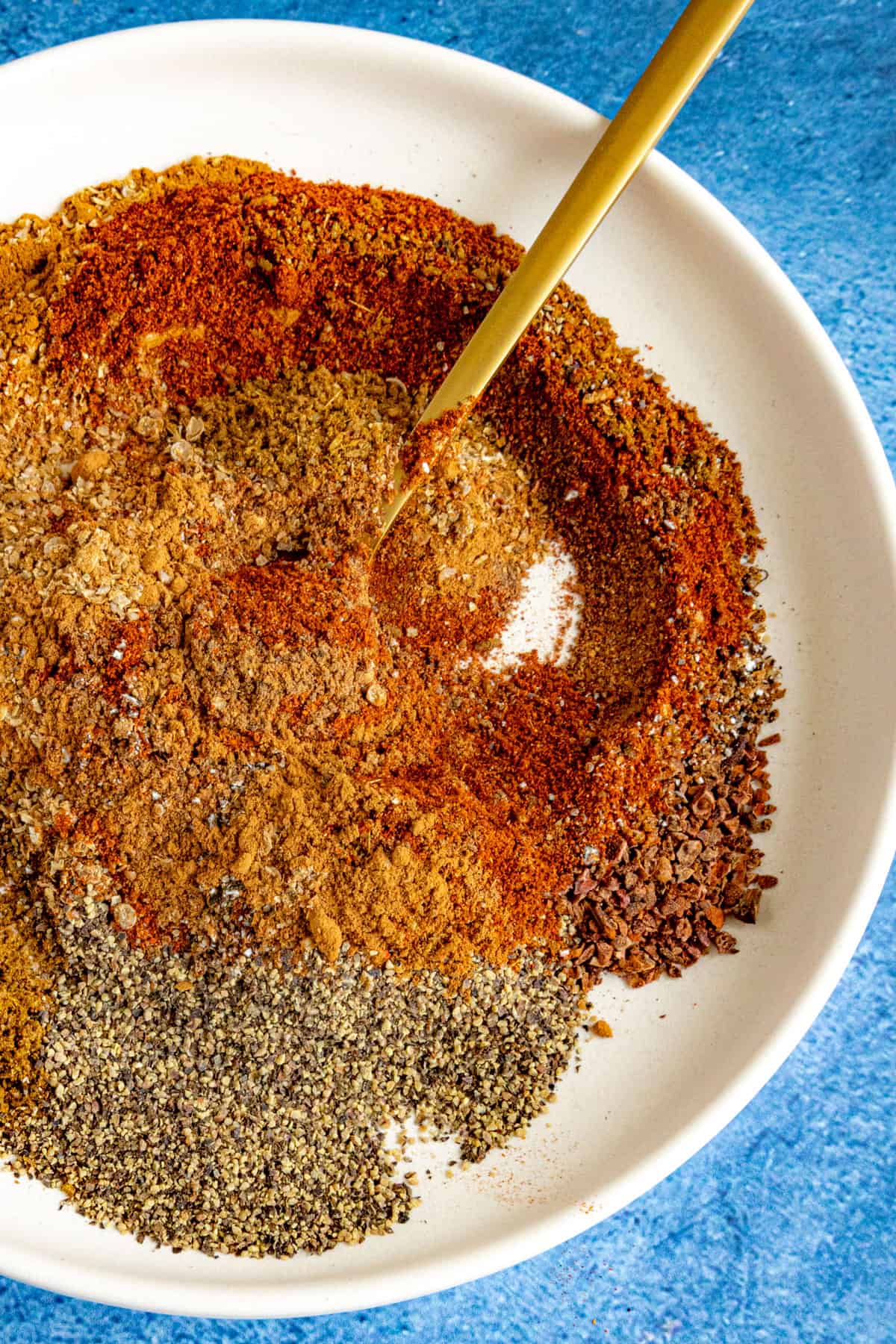 Mixing Baharat Spice Blend ingredients on a plate