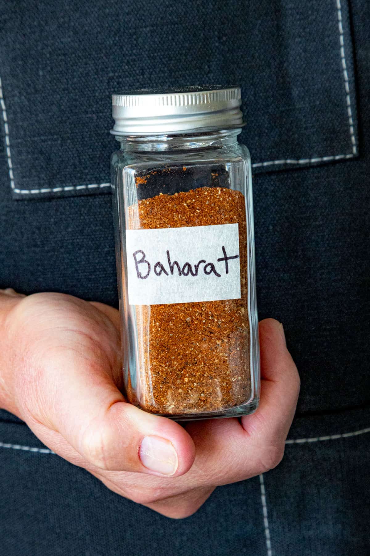 Mike holding a jar of Baharat Spice Blend