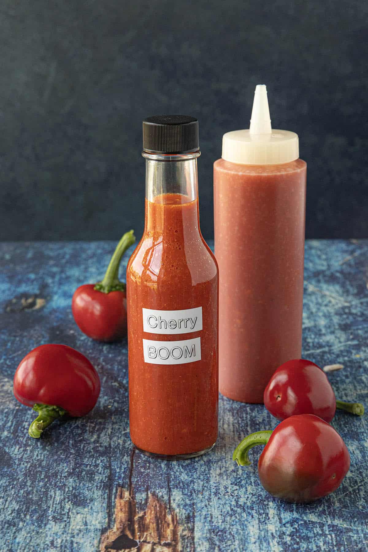 Cherry Bomb Hot Sauce in a bottle and also a squeeze bottle