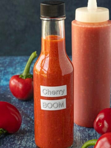 Cherry Bomb Hot Sauce in a bottle, ready to serve