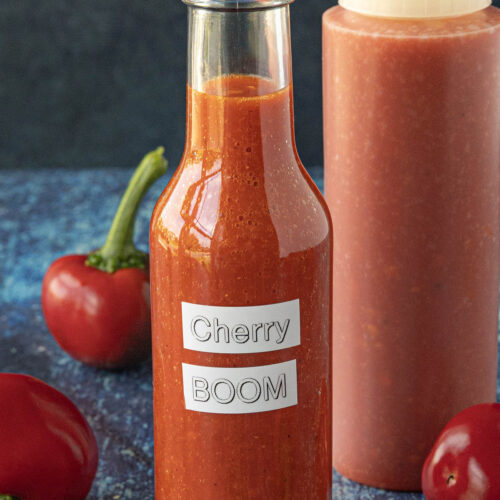 Cherry Bomb Hot Sauce in a bottle, ready to serve