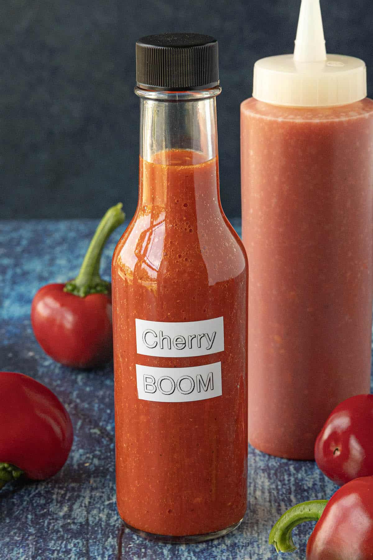 Cherry Bomb Hot Sauce in a bottle, ready to serve