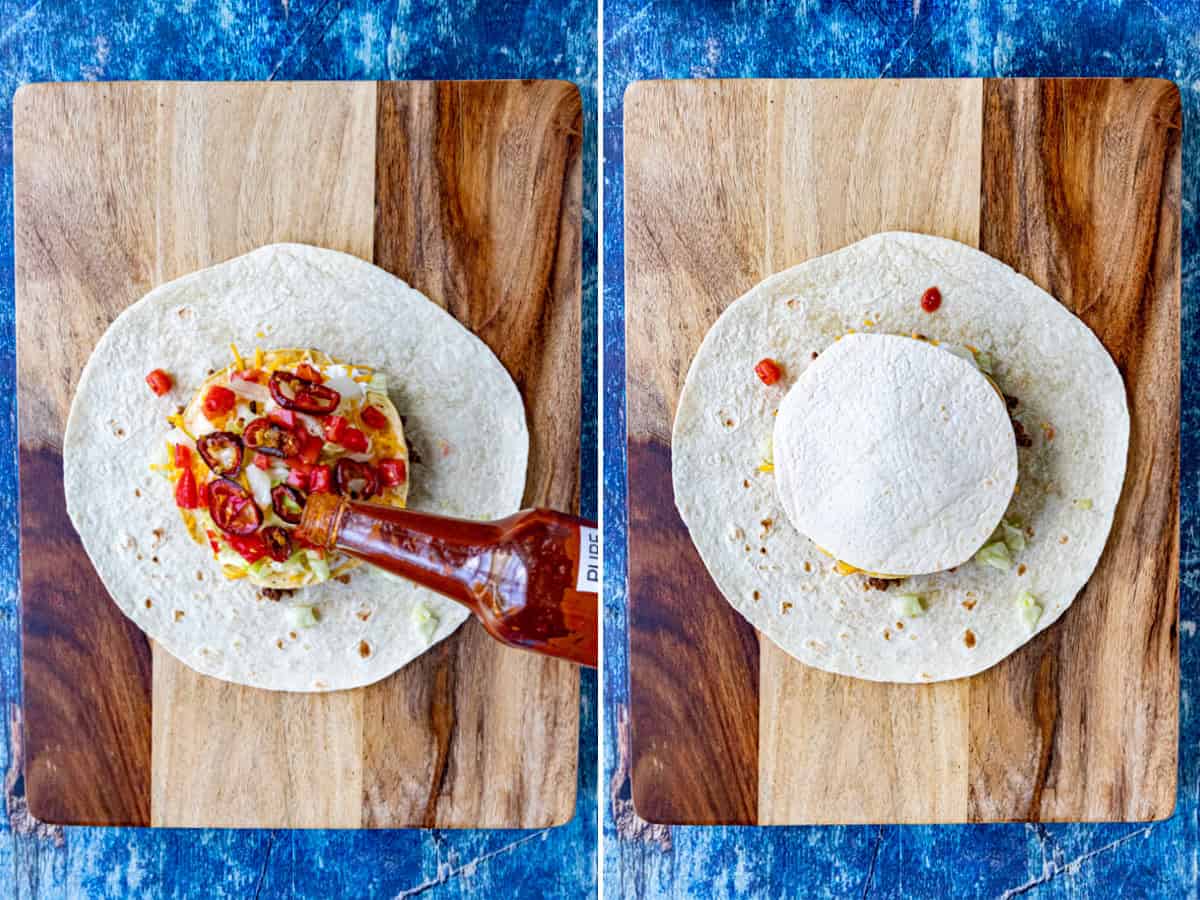 Layering hot sauce and roasted jalapeno slices onto a large flour tortilla to make a Homemade Crunchwrap Supreme, spicy version