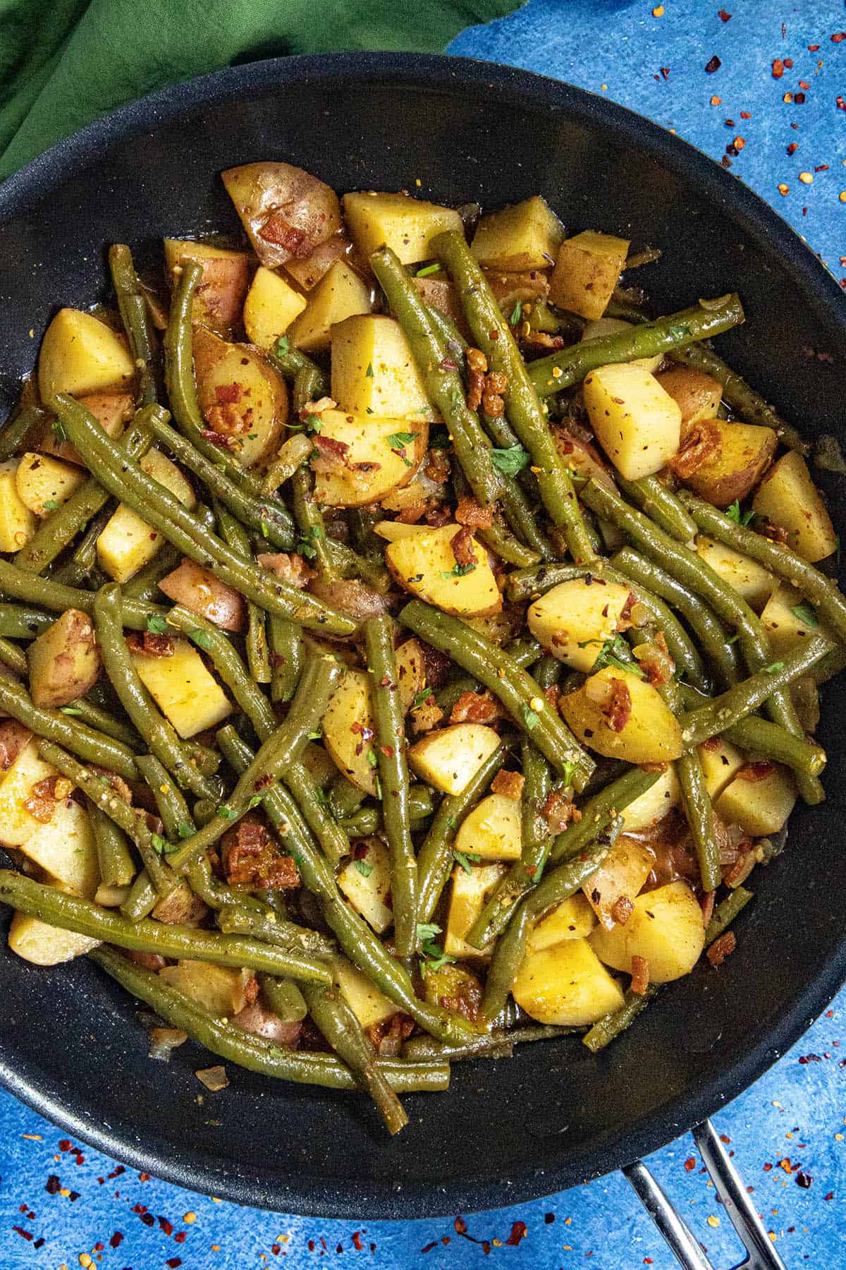 Smothered green beans and potatoes in a pan, ready to serve