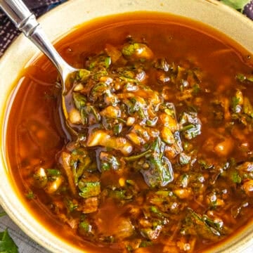 Zesty, vibrant chermoula in a bowl with a spoon