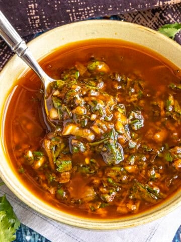 Zesty, vibrant chermoula in a bowl with a spoon