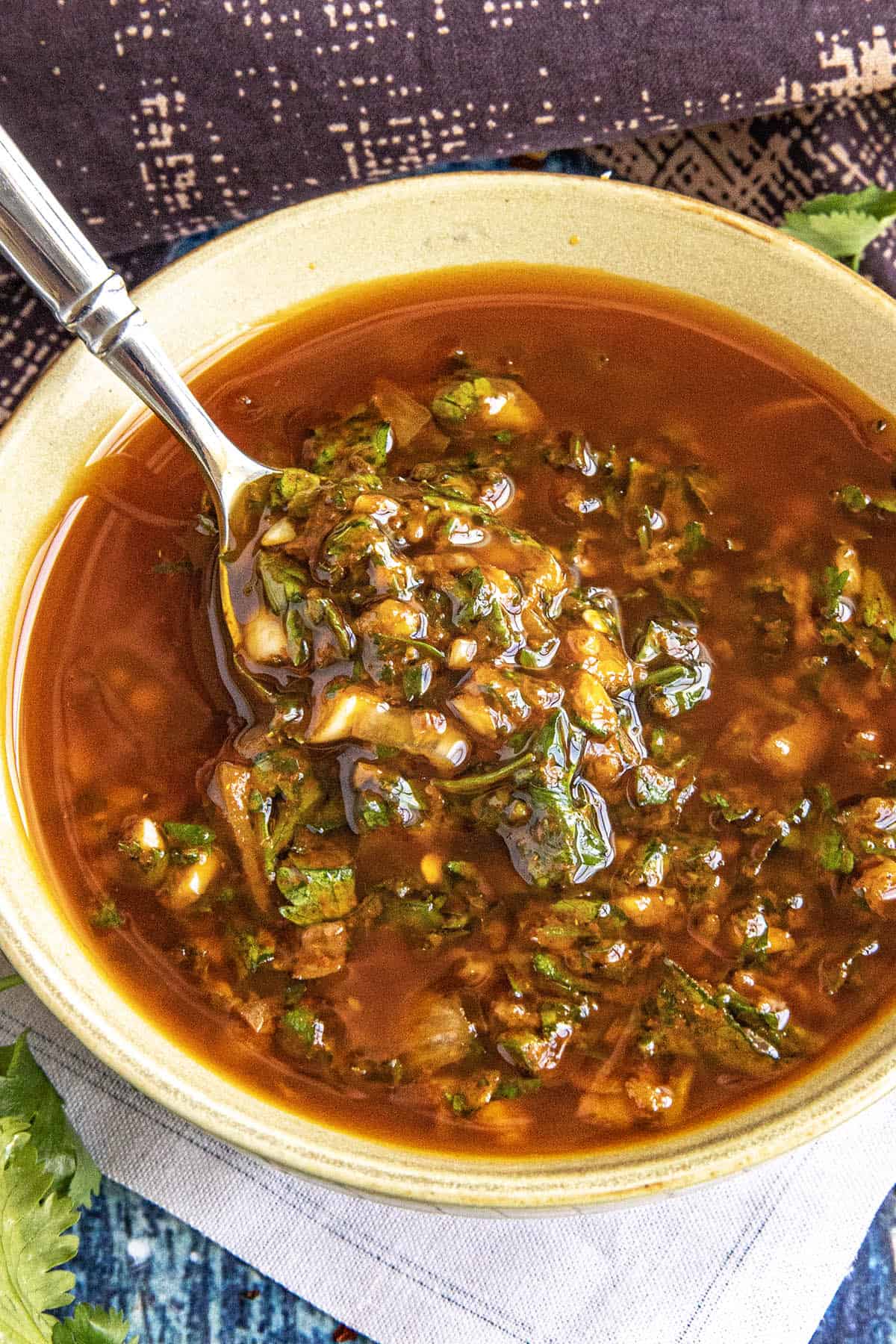 Zesty, vibrant chermoula in a bowl with a spoon