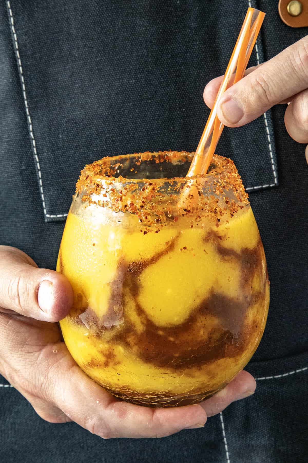 Mike holding a Mangonada Margarita
