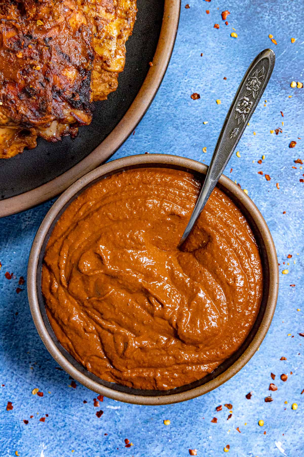 Mexican style Cascabel Chili Sauce in a bowl with a spoon, ready to serve