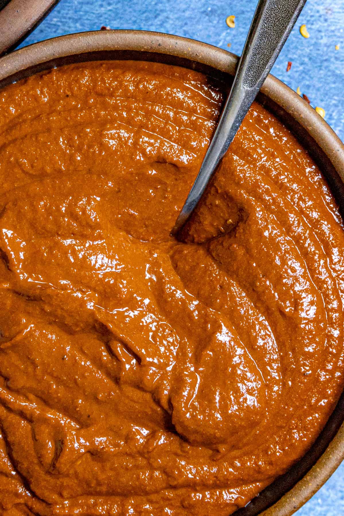 Mexican style Cascabel Chili Sauce in a bowl with a spoon