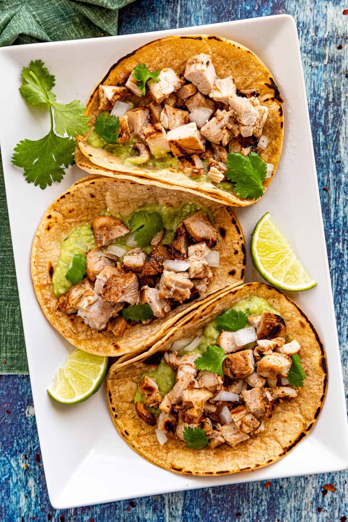3 Chicken Tacos on a plate with lime