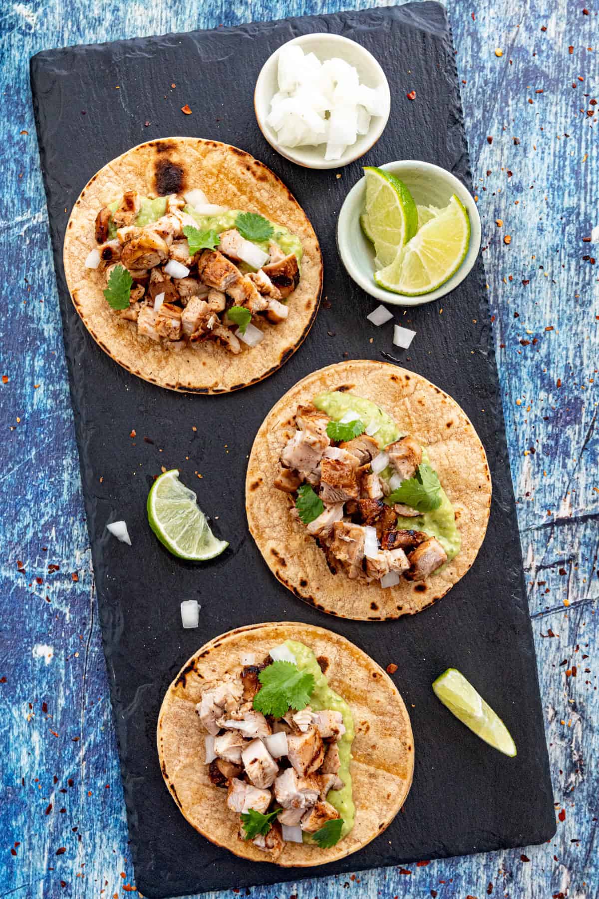 3 Chicken Tacos served on a platter with garnish