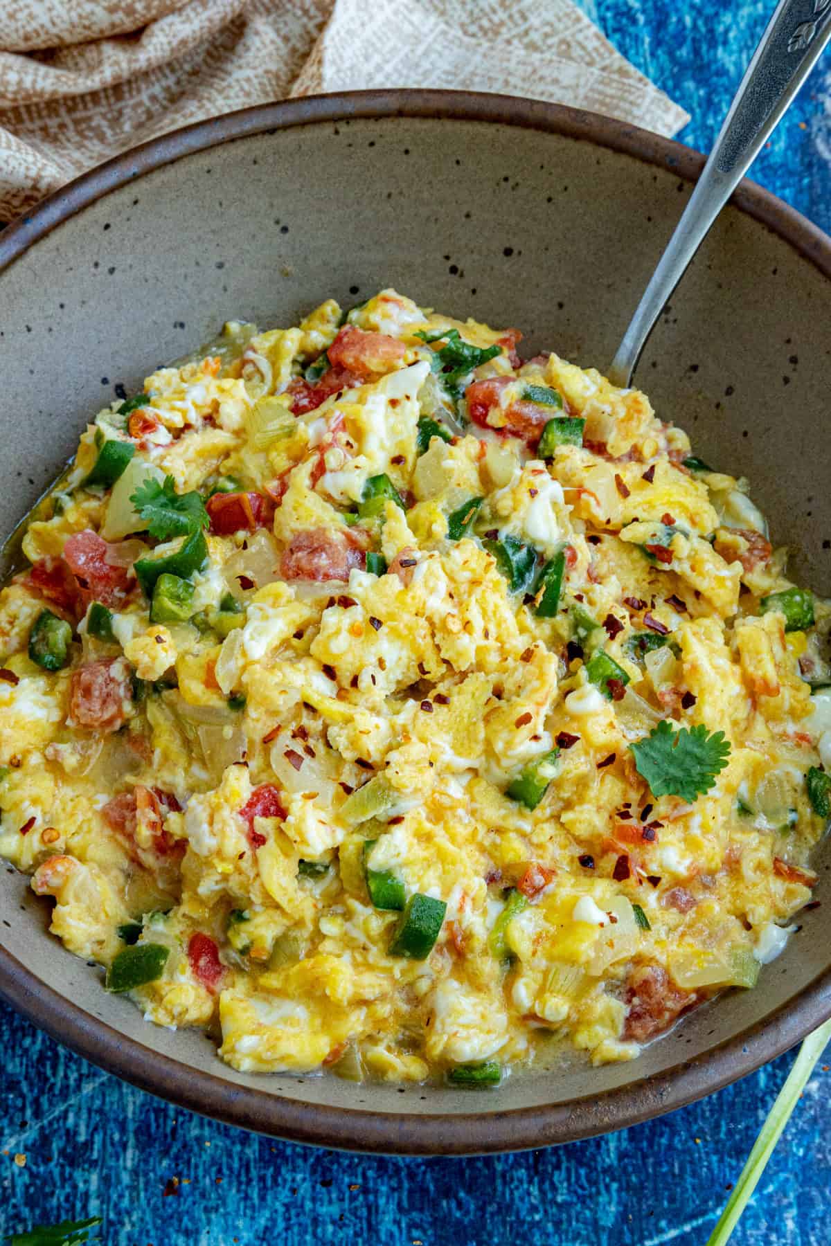 A serving bowl filled with Huevos a la Mexicana