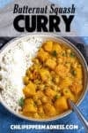 Spicy Thai-style Butternut Squash Curry with Chickpeas in a bowl with rice, ready to serve