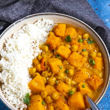 Thai-style Butternut Squash Curry served in a bowl over rice