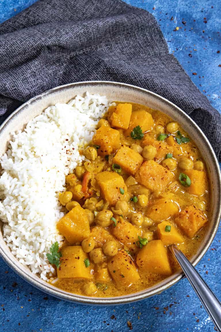 Thai-style Butternut Squash Curry served in a bowl over rice