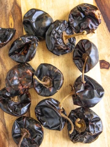 A pile of Cascabel Pepper (Chile Cascabel) on a board