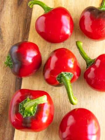 A group of cherry peppers on a platter