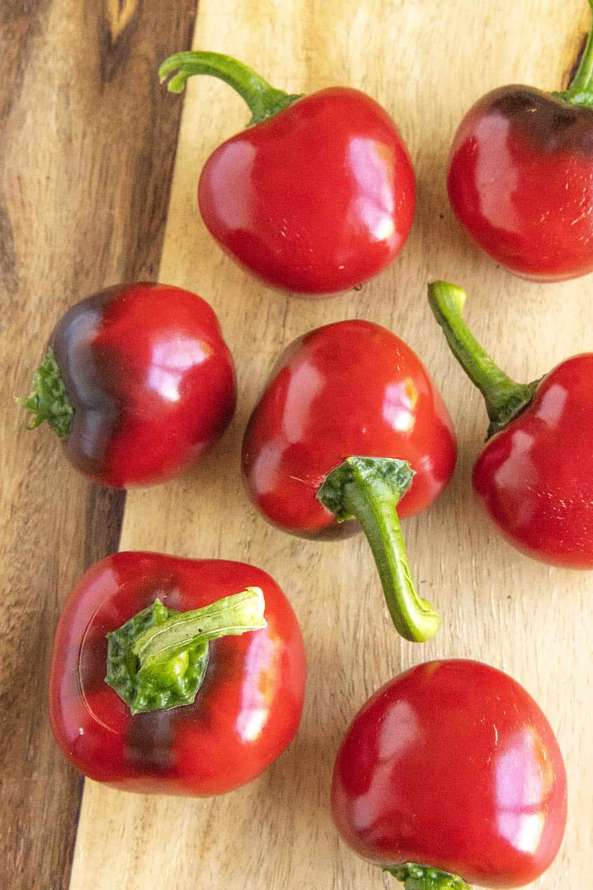 A group of cherry peppers on a platter