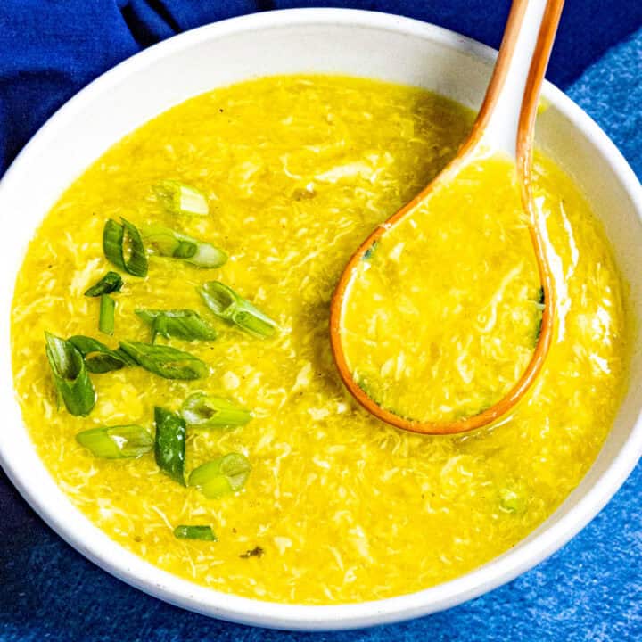 Chinese egg drop soup served in a bowl, garnished with freshly sliced green onions