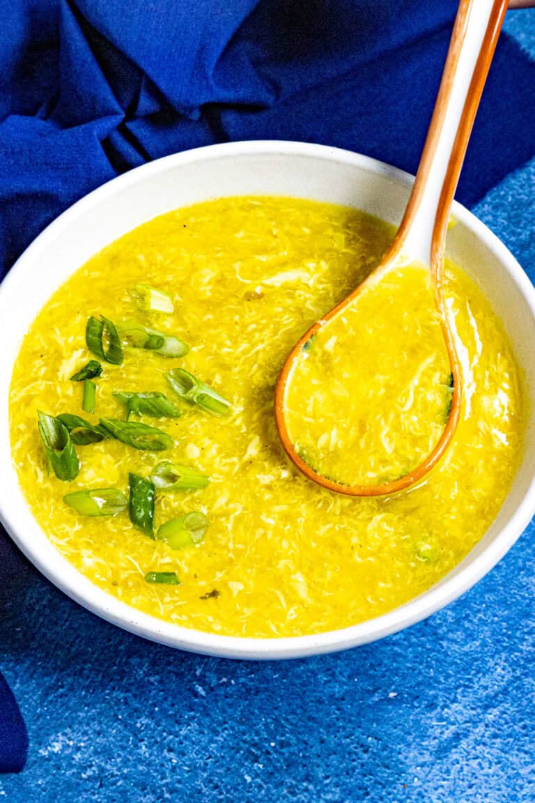 Chinese egg drop soup served in a bowl, garnished with freshly sliced green onions