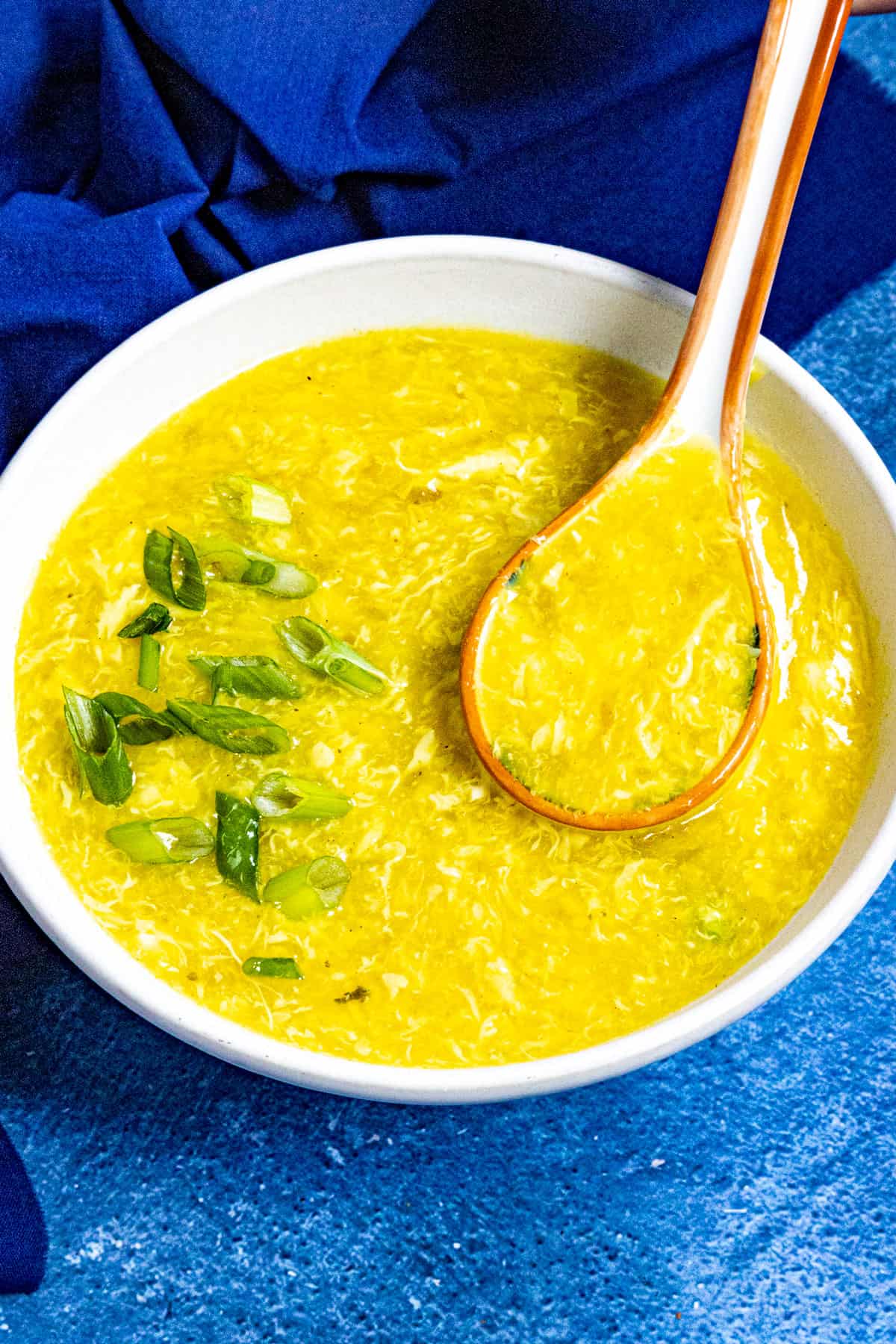 Chinese egg drop soup served in a bowl, garnished with freshly sliced green onions