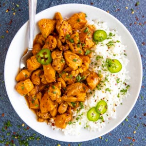 Easy Gochujang Chicken on a plate served with rice