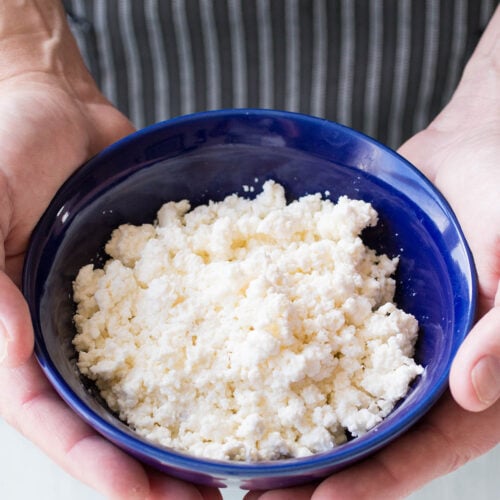 Mike holding a bowl of Homemade Queso Fresco