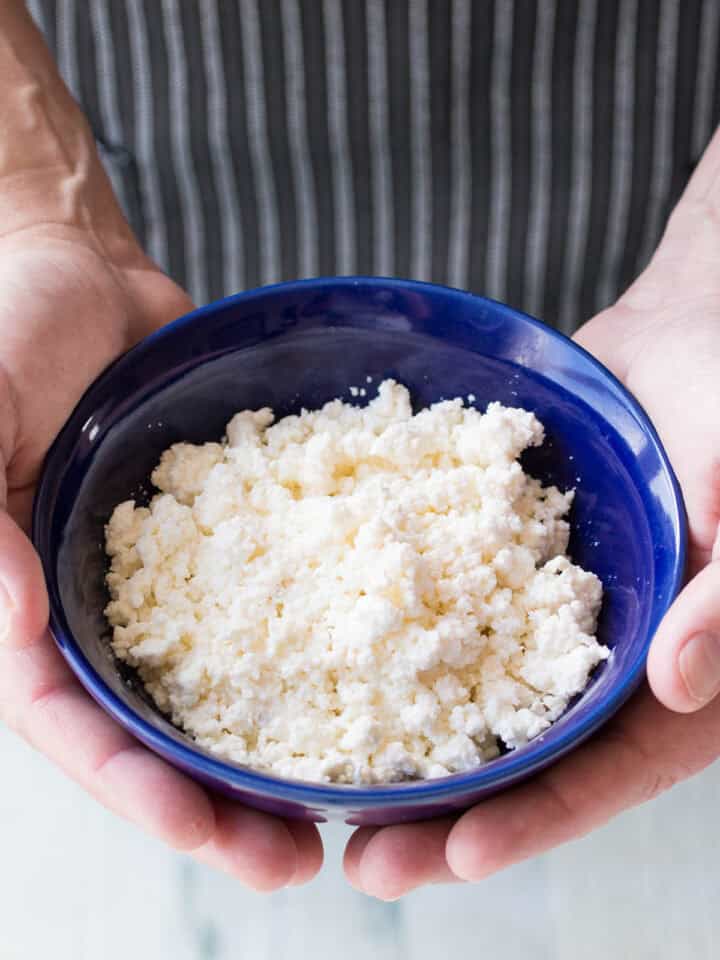 Mike holding a bowl of Homemade Queso Fresco
