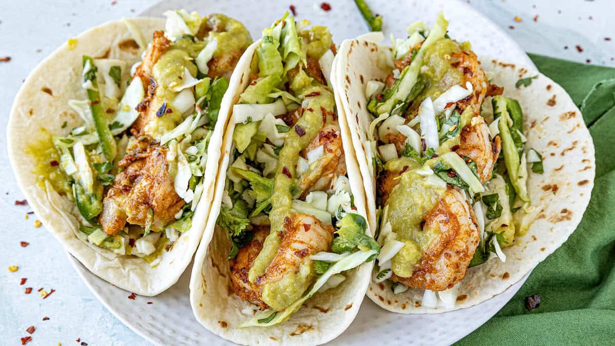 Shrimp Tacos Recipe (with Creamy Jalapeno Sauce and Crunchy Slaw)